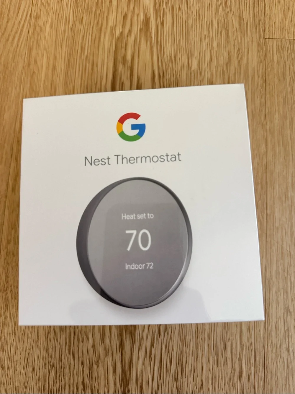 google Nest Thermostat - White Packaging with Gray Thermostat Image
